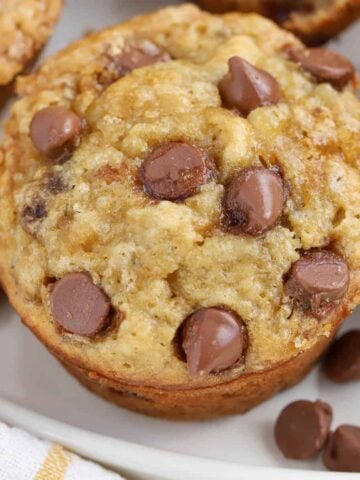 Close up of Banana Chocolate Chip Muffin on a white plate