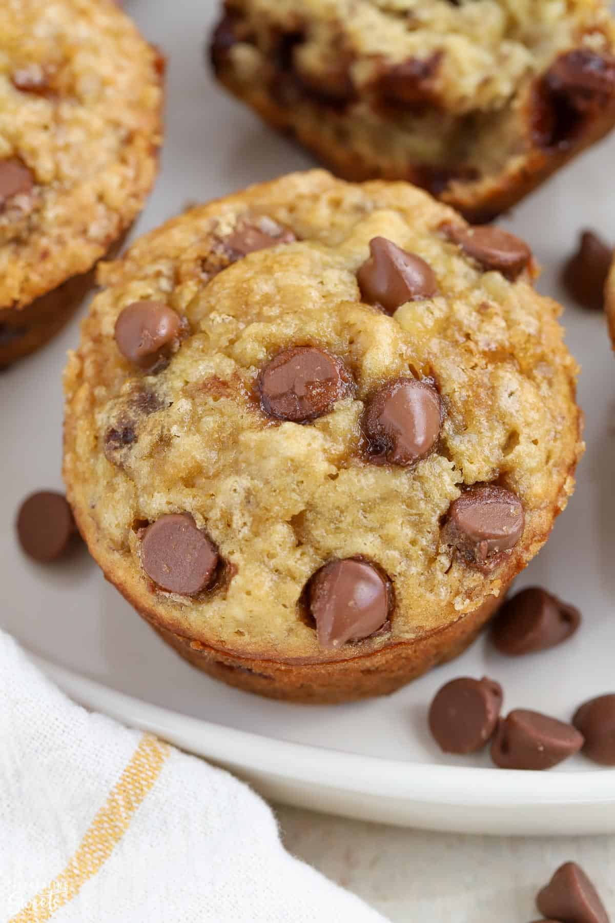 Close up of Banana Chocolate Chip Muffin on a white plate