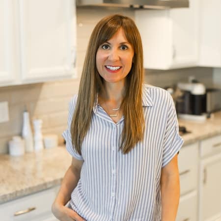Woman standing in kitchen