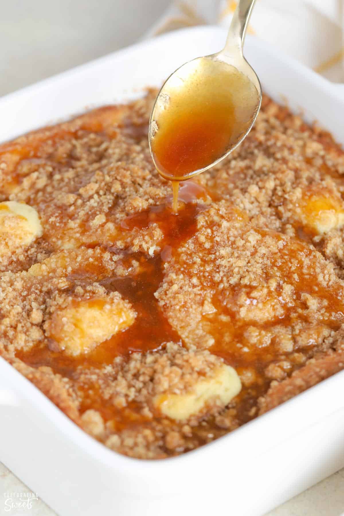 Brown sugar glaze being poured over a pineapple cake