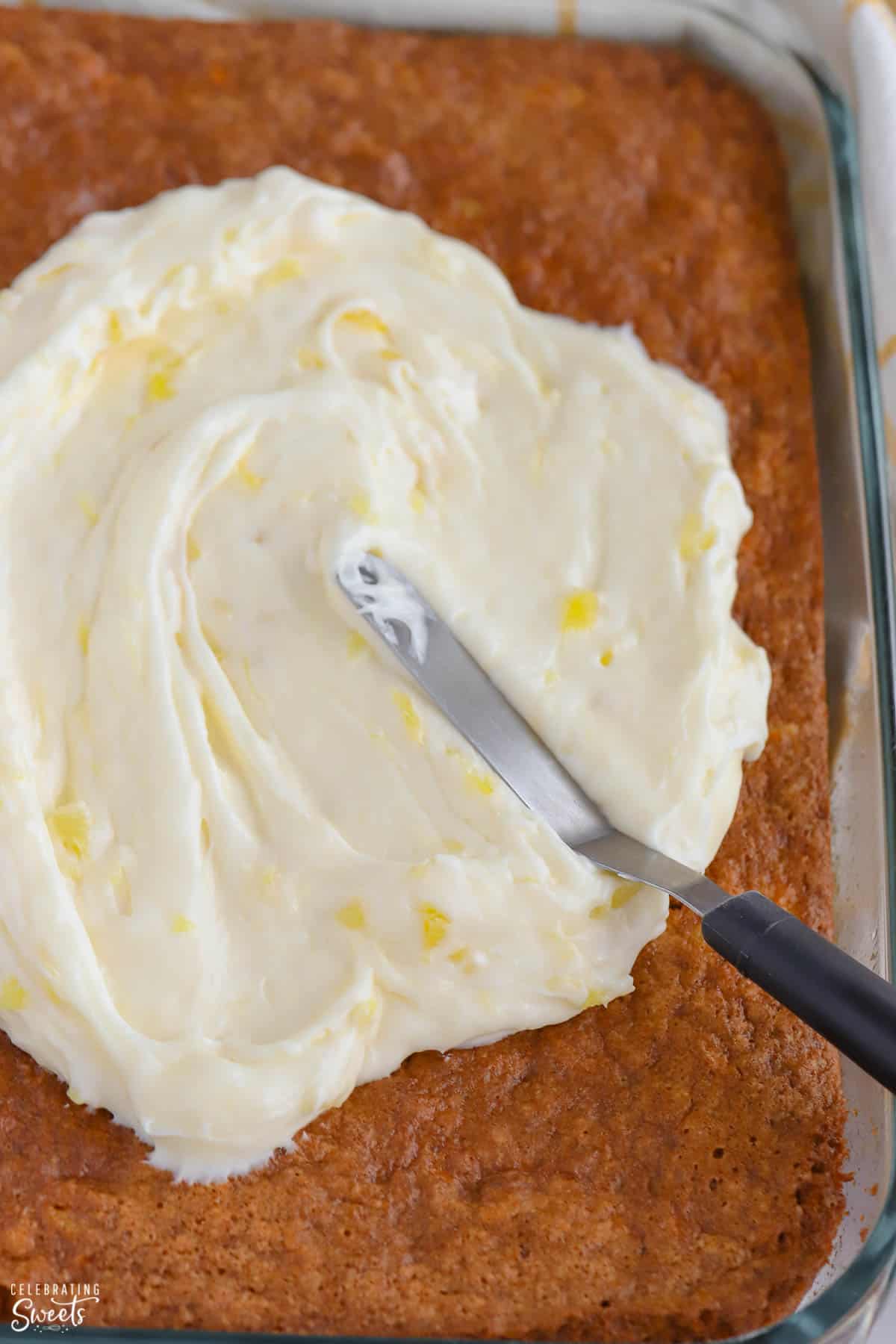 Pineapple Carrot Cake sheet cake topped with pineapple frosting.