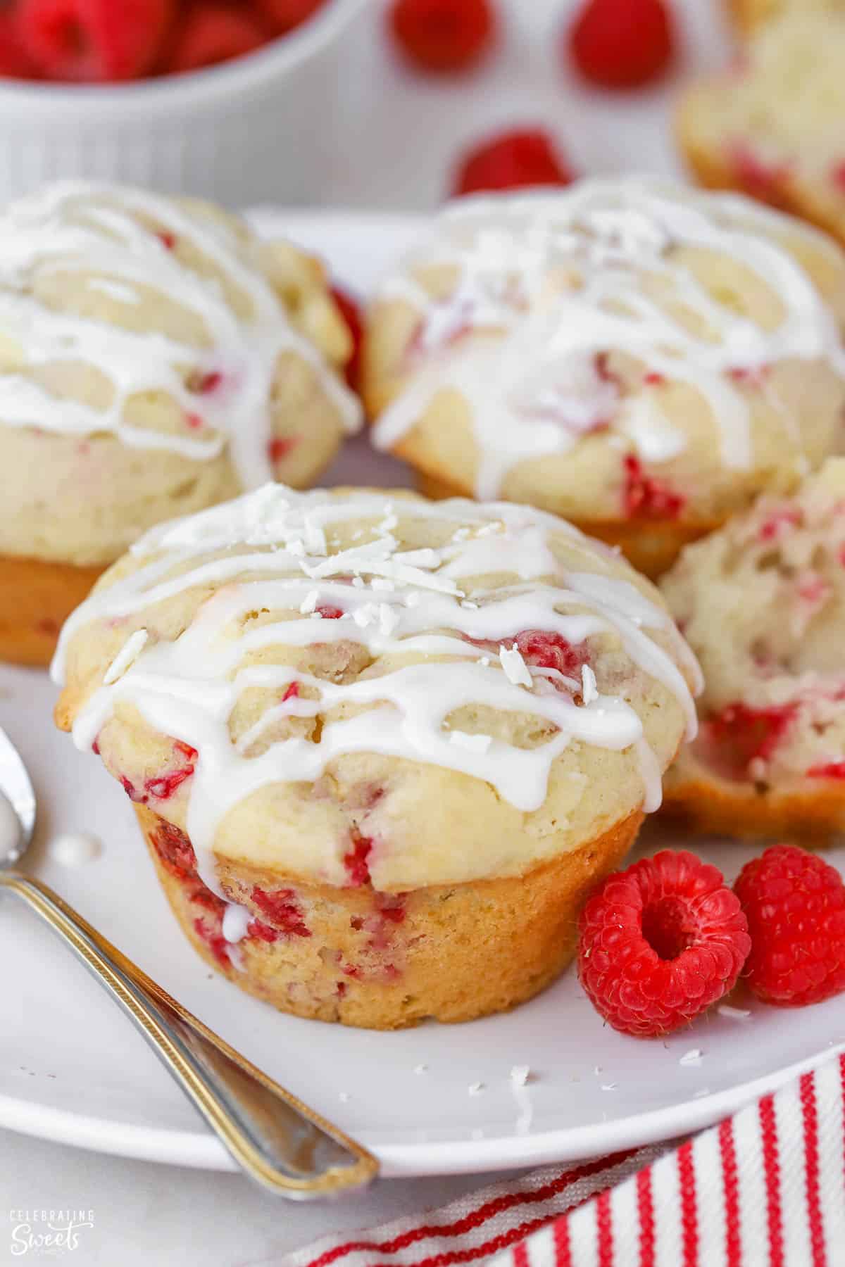 Closeup of raspberry muffins drizzled with icing.