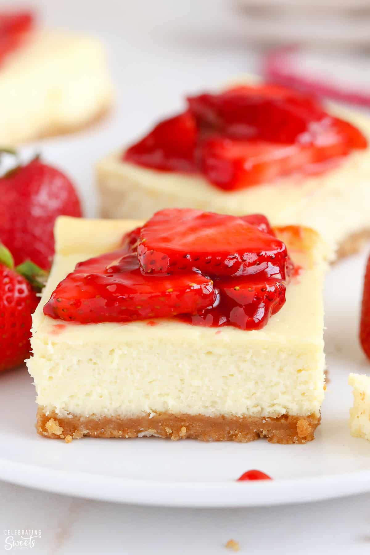 Cheesecake bar topped with strawberries