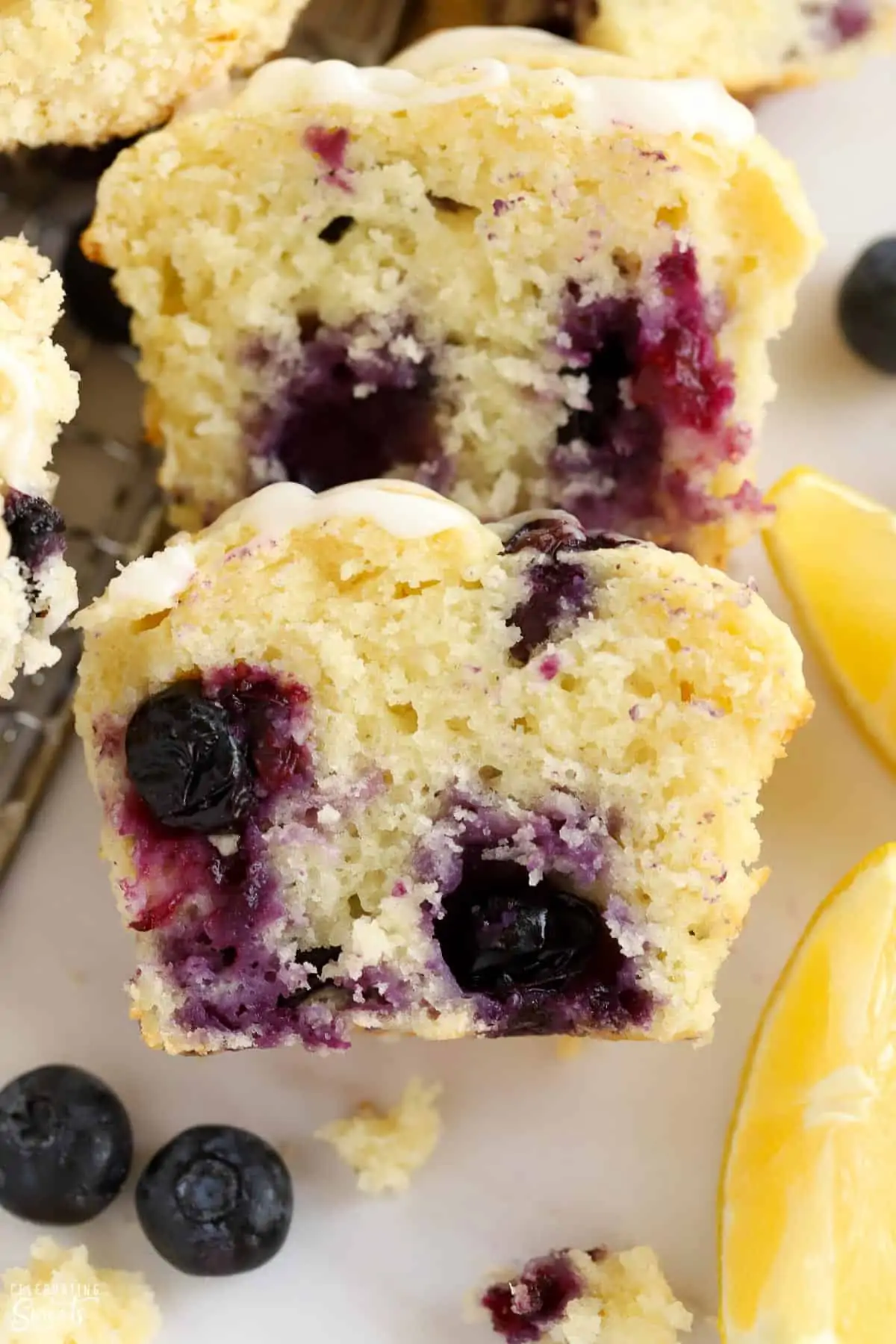 Closeup of a lemon blueberry muffin cut in half.