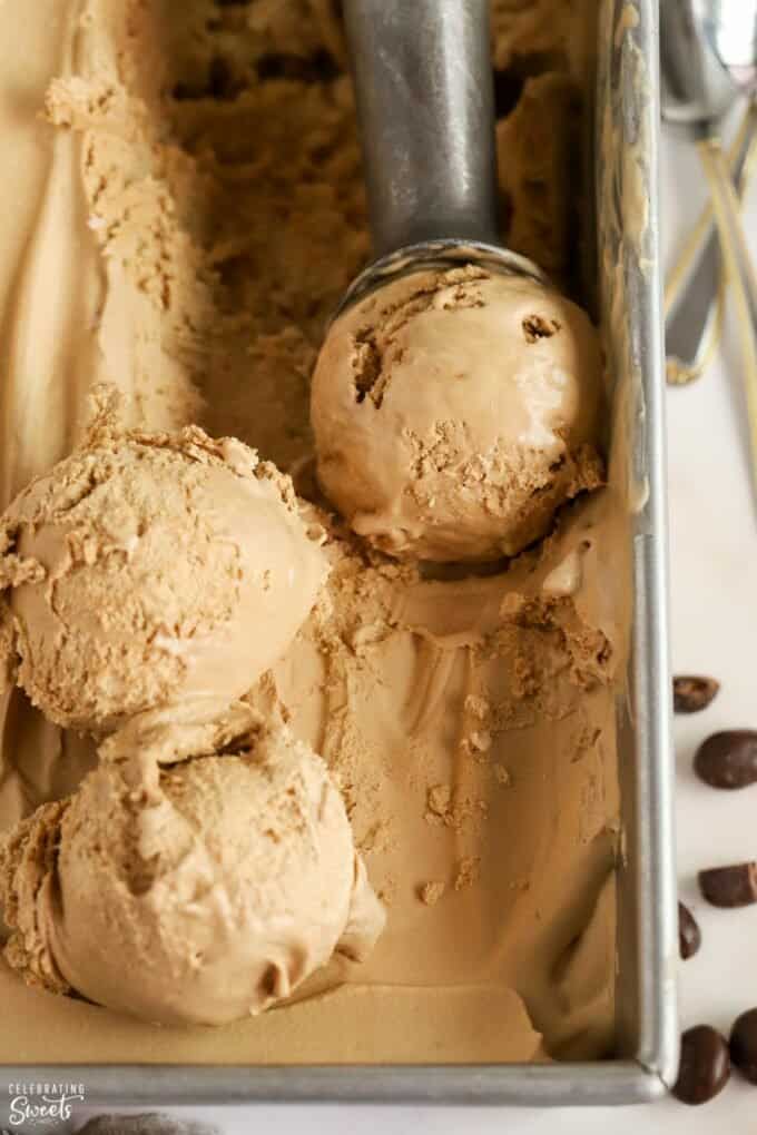 Coffee ice cream in a metal loaf pan.