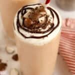 Closeup of chocolate malt topped with whipped cream and chocolate sauce.