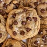 Closeup of espresso chocolate chips cookies topped with flaky sea salt.