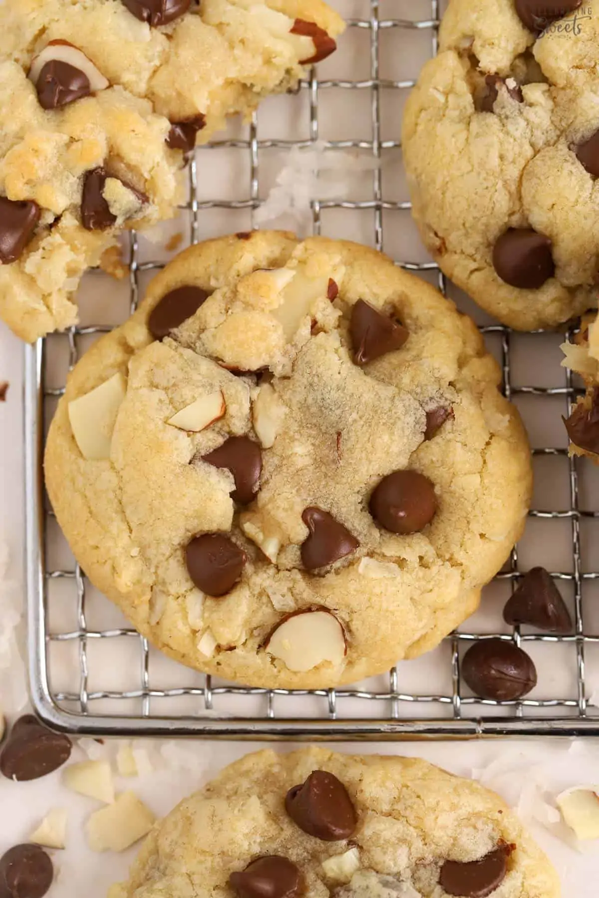 Closeup of almond joy cookies on a wire rack.