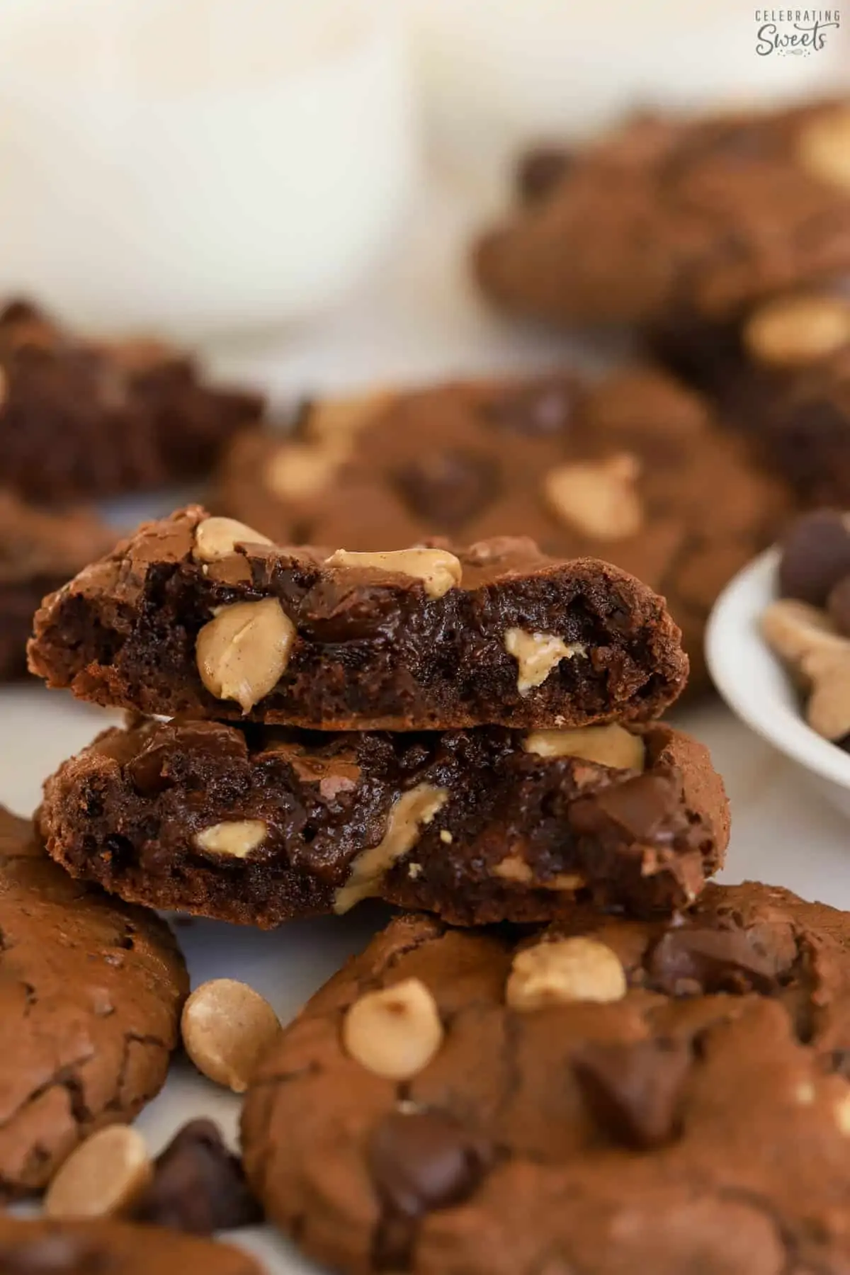 Peanut butter brownie cookies stacked on top of each other.
