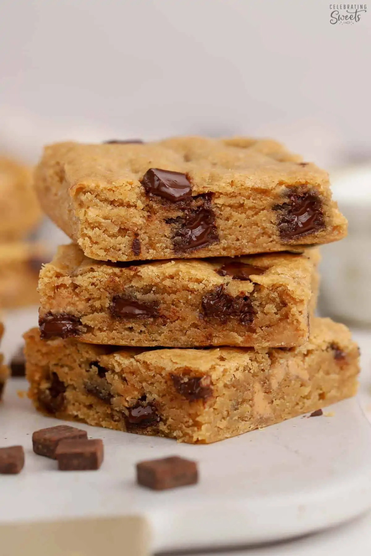 Stack of three chocolate chip blondies.