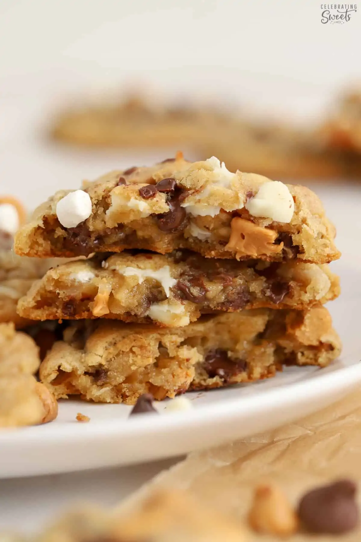 Stack of kitchen sink cookies broke in half on a white plate.