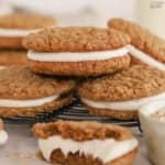 Stack of oatmeal cream pies on a wire rack.