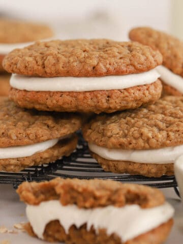 Stack of oatmeal cream pies on a wire rack.