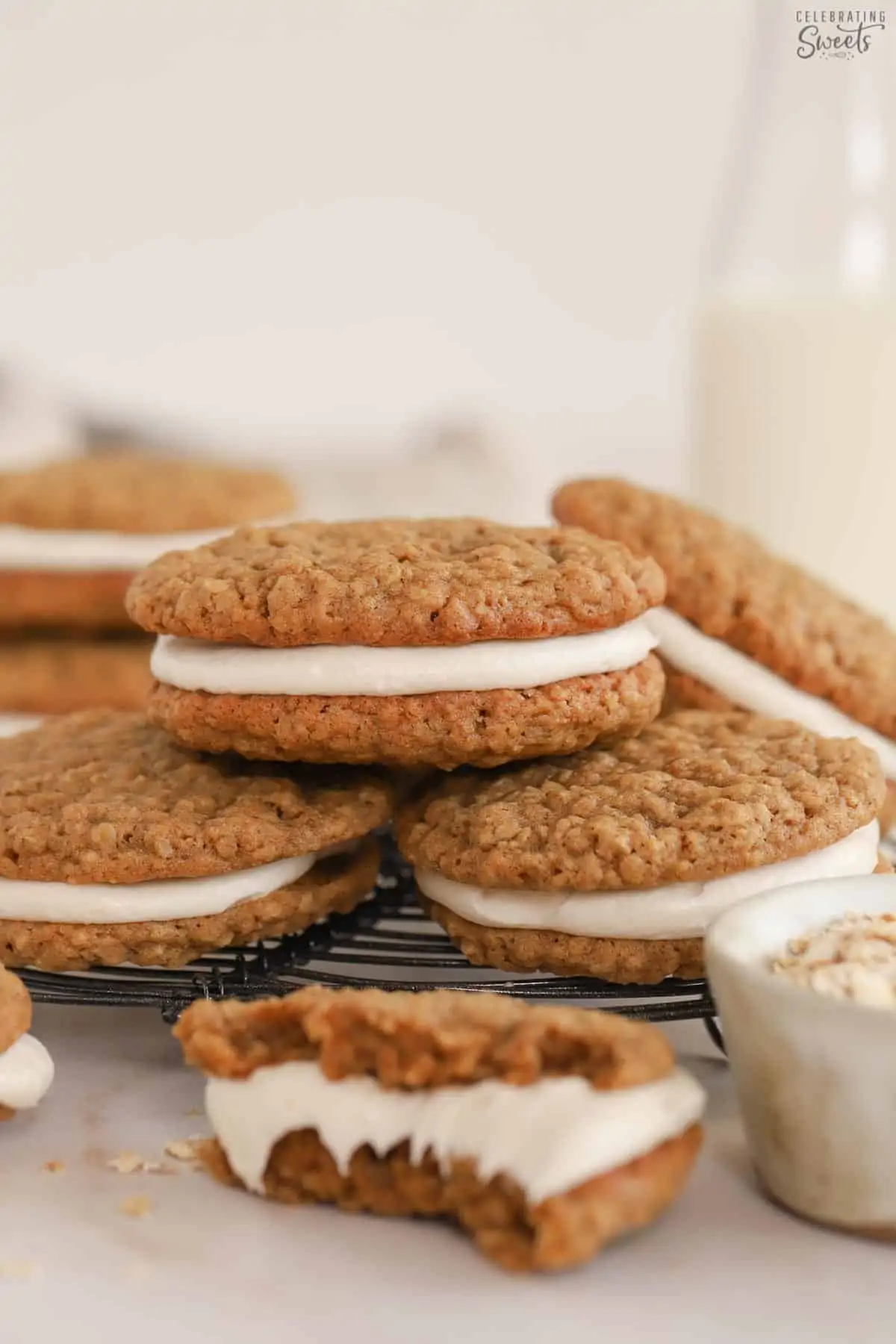 Stack of oatmeal cream pies on a wire rack.