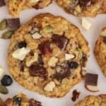 Trail mix cookies on a white board.