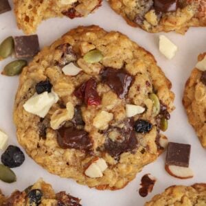 Trail mix cookies on a white board.