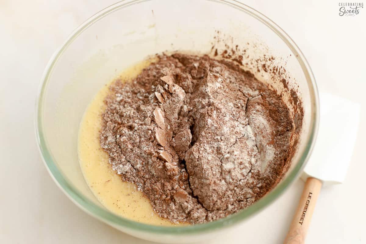 Brownie batter in a glass bowl.