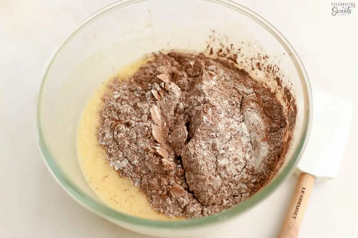 Brownie batter in a glass bowl.