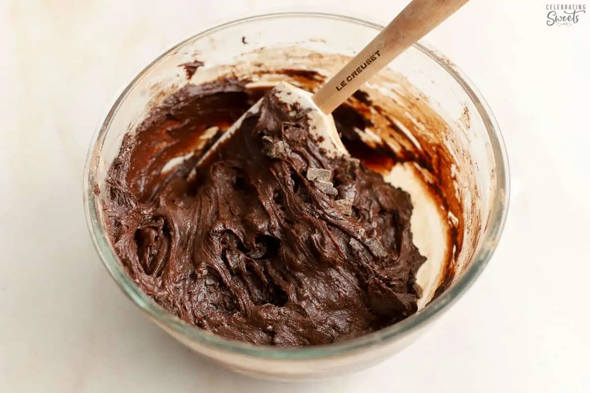 Brownie batter in a glass bowl.