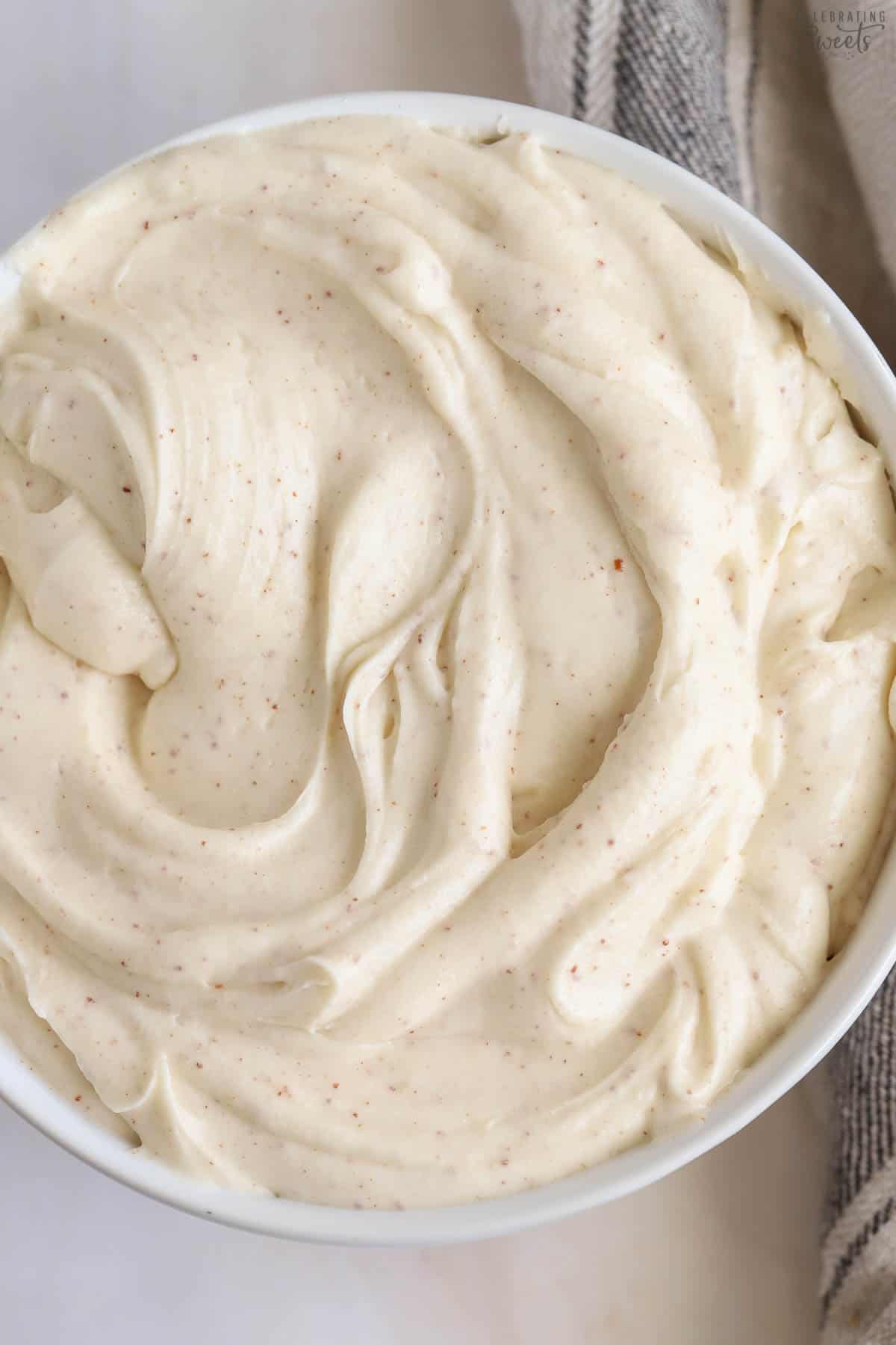 Brown butter cream cheese frosting in a white bowl