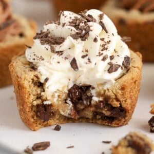 Cookie cup with a bite taken out of it.
