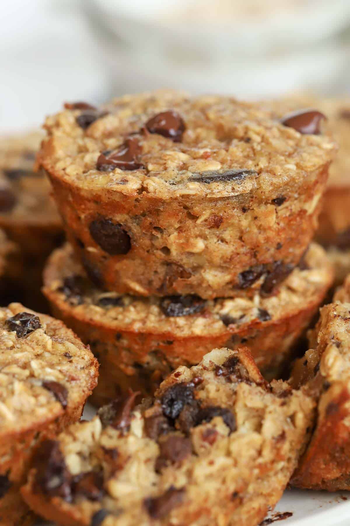Stack of baked oatmeal cups with chocolate and raisins.