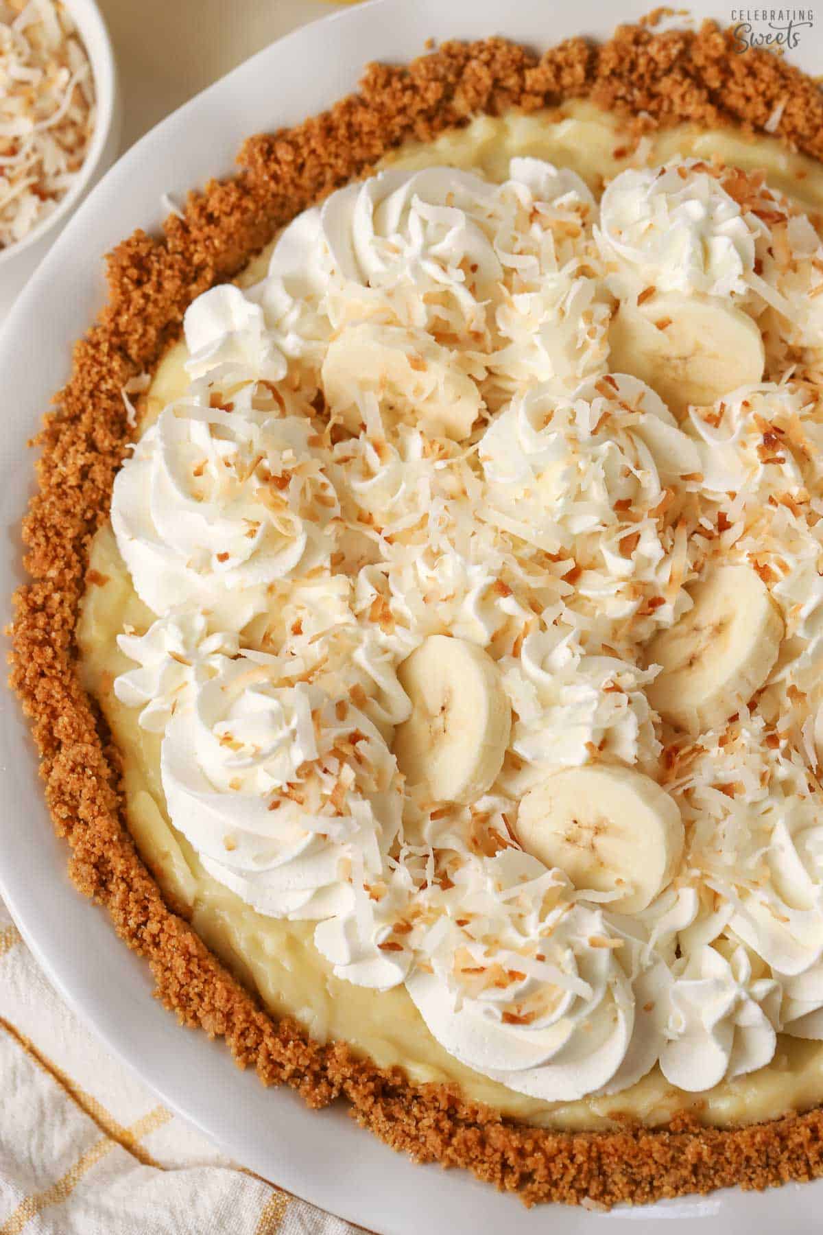 Banana Coconut Cream Pie in a white pie plate