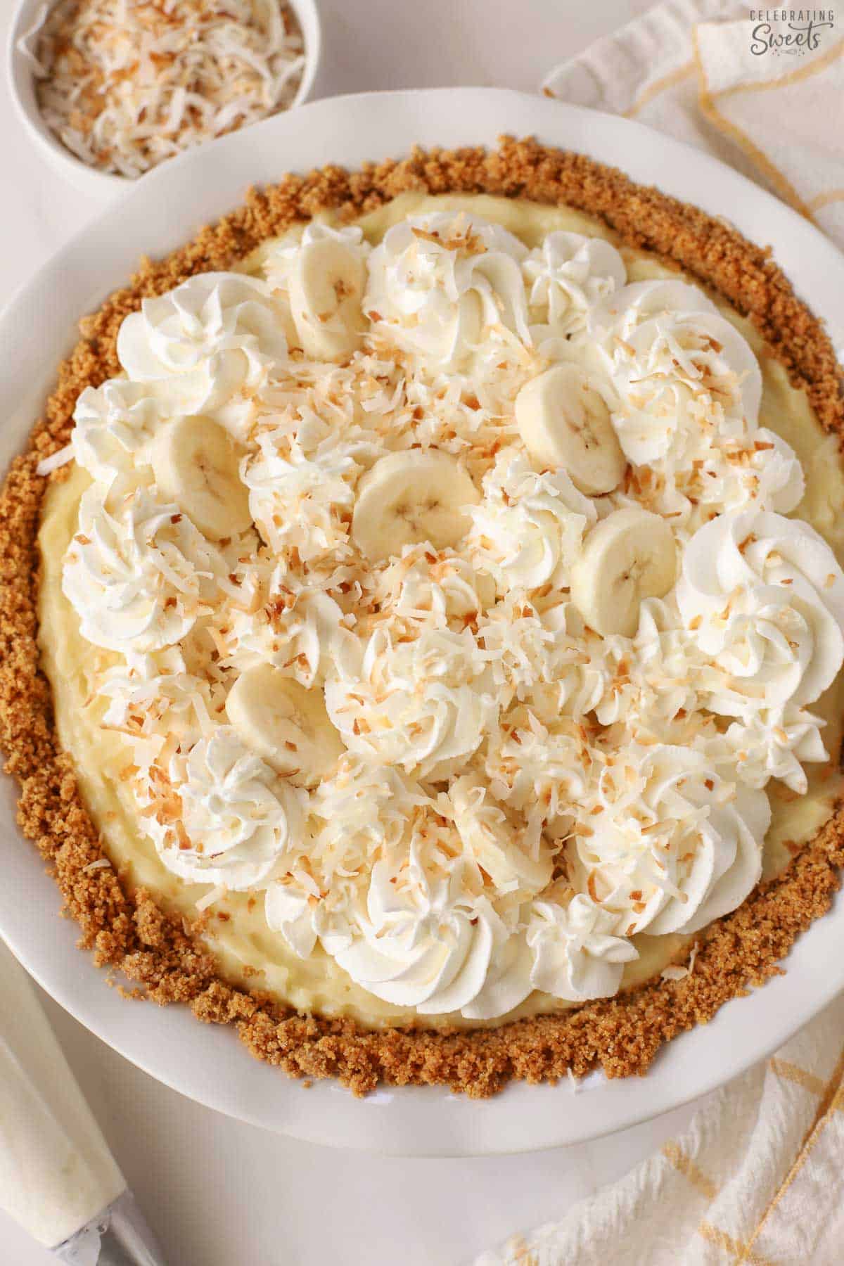 Banana Coconut Cream Pie in a white pie plate
