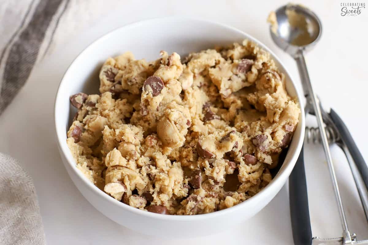 Cookie dough in a white bowl.