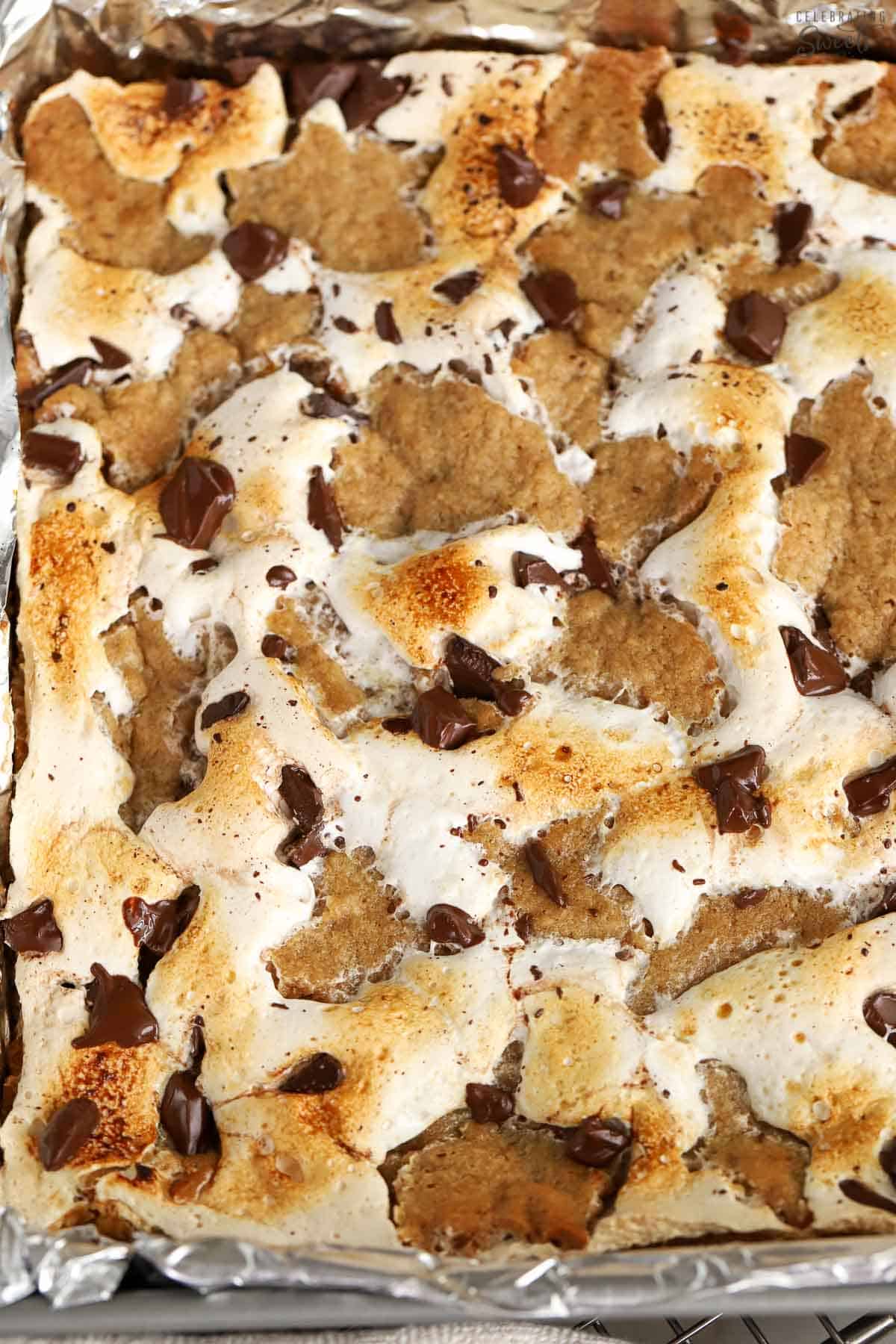 Closeup of s'mores bars in a metal pan.