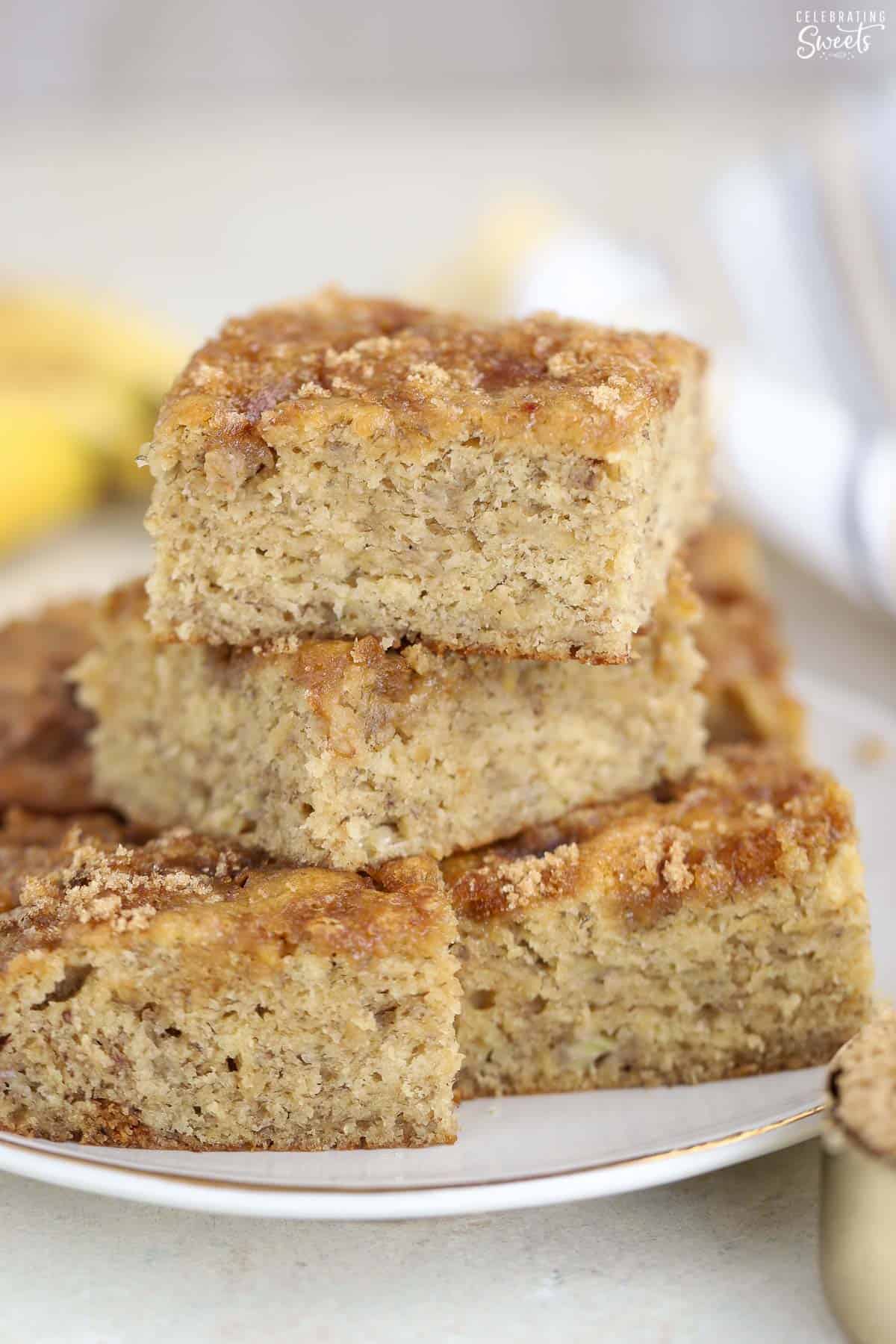 Slices of banana bread stacked on a plate.