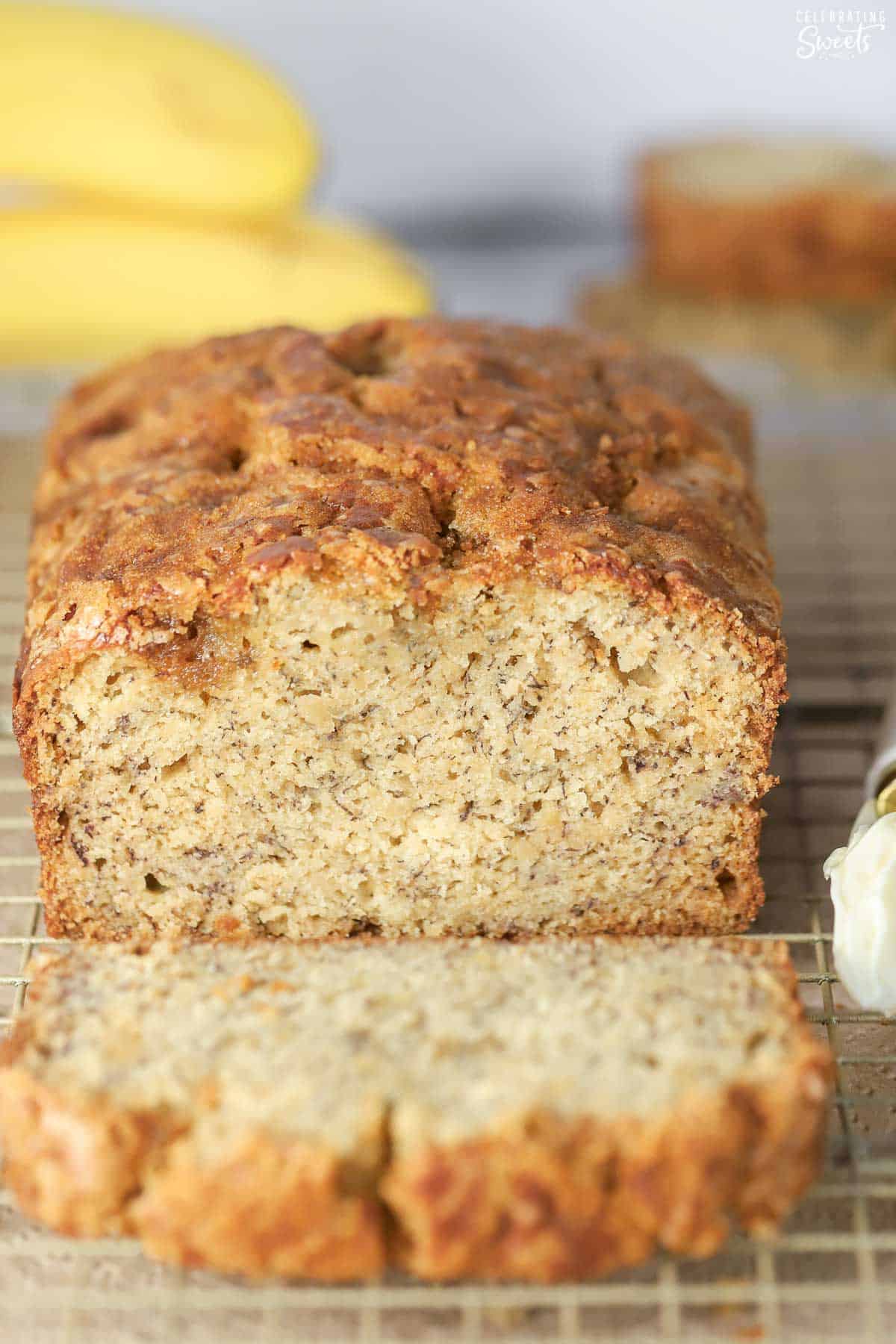 Loaf of banana bread on a wire rack.