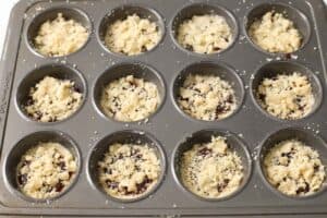 Raspberry crumble cookies in a muffin tin.