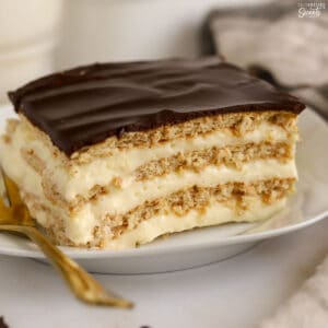 Slice of eclair cake on a white plate.