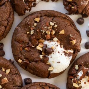 Chocolate cookie topped with marshmallows and nuts.