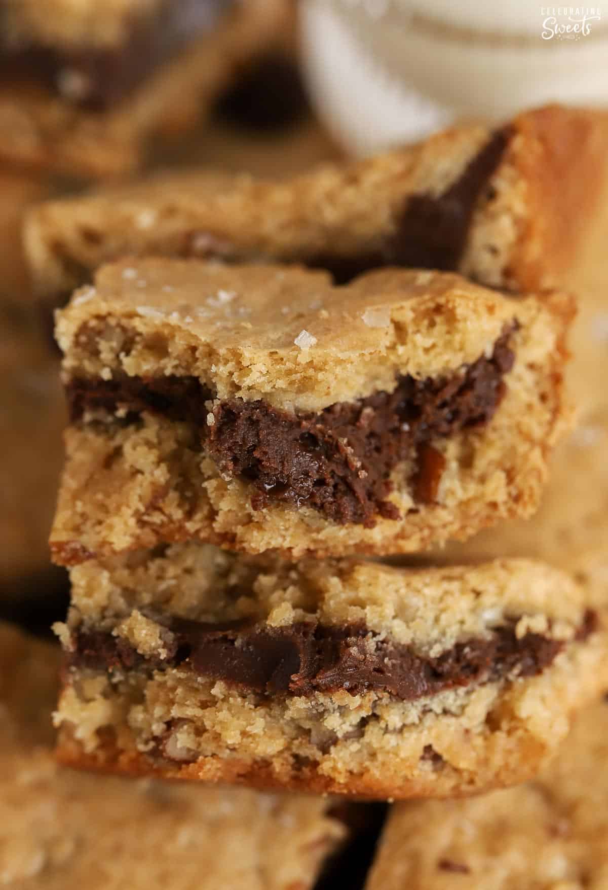 Closeup of a fudge stuffed blondie torn into two pieces.