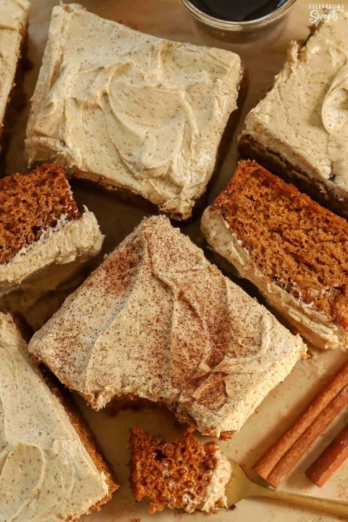 Slices of pumpkin spice latte cake on brown parchment paper.