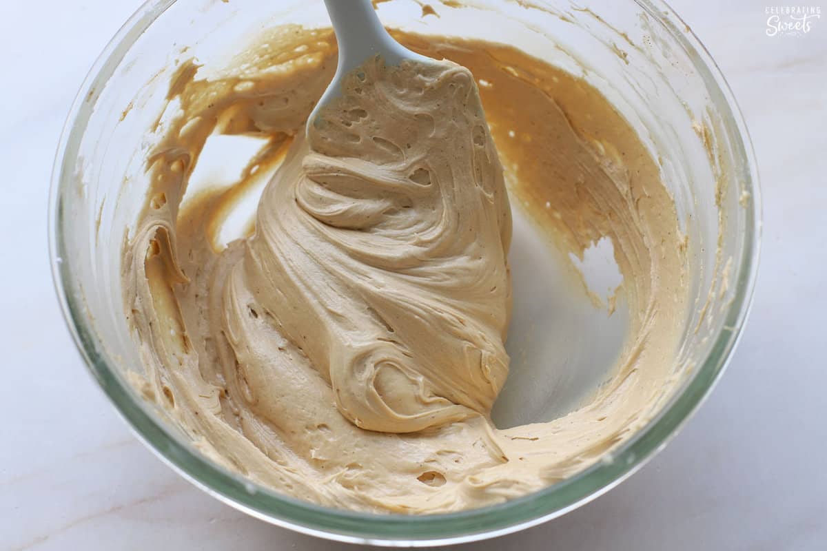 Espresso frosting in a glass bowl.