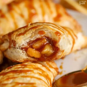 Closeup of an apple turnover with a bite taken out of it.