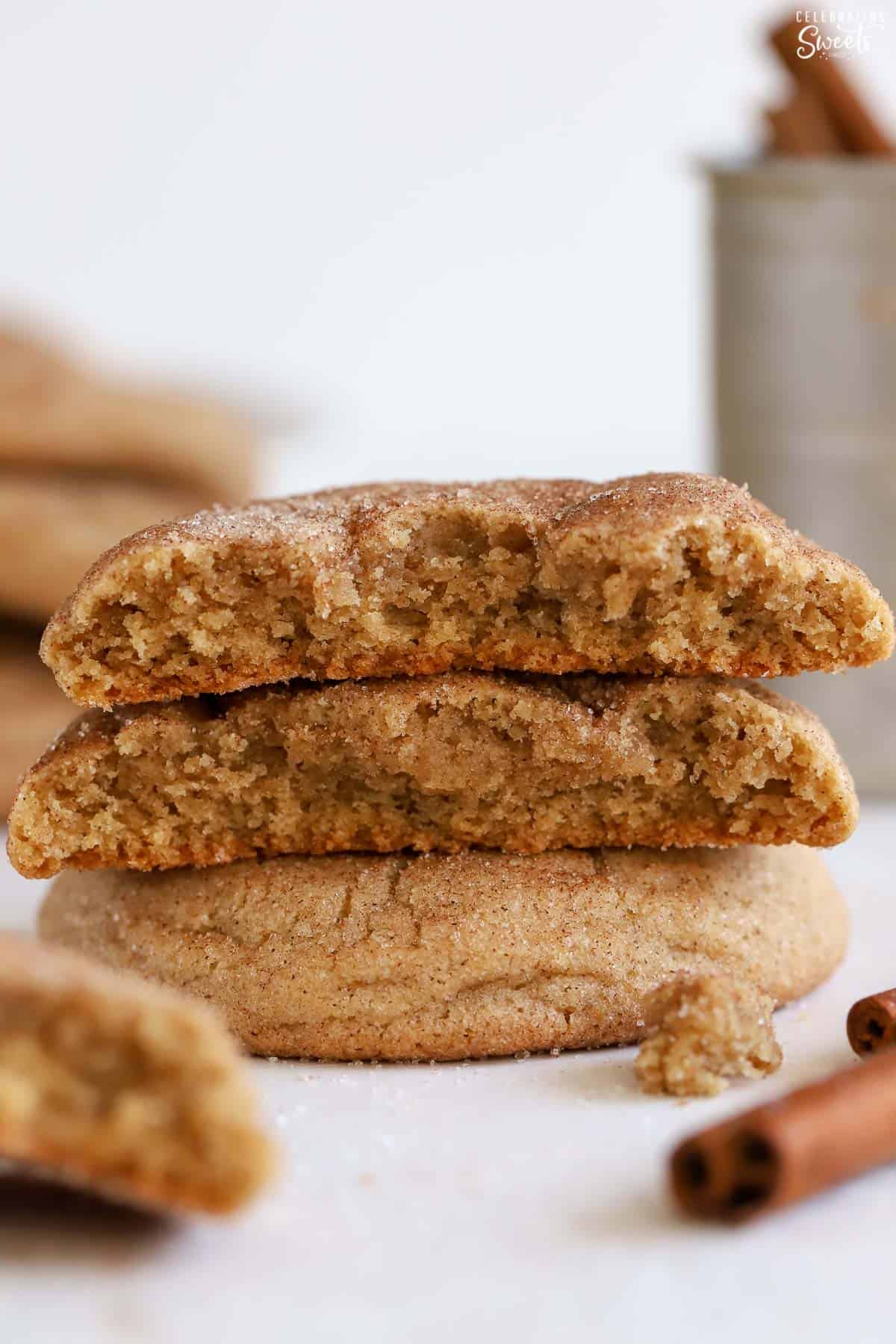 Two halves of maple snickerdoodle cookies stacked on top of each other.