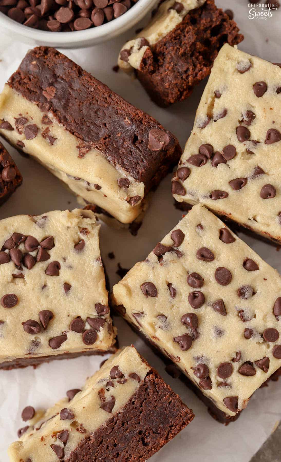 Closeup of brownies topped with chocolate chip cookie dough.