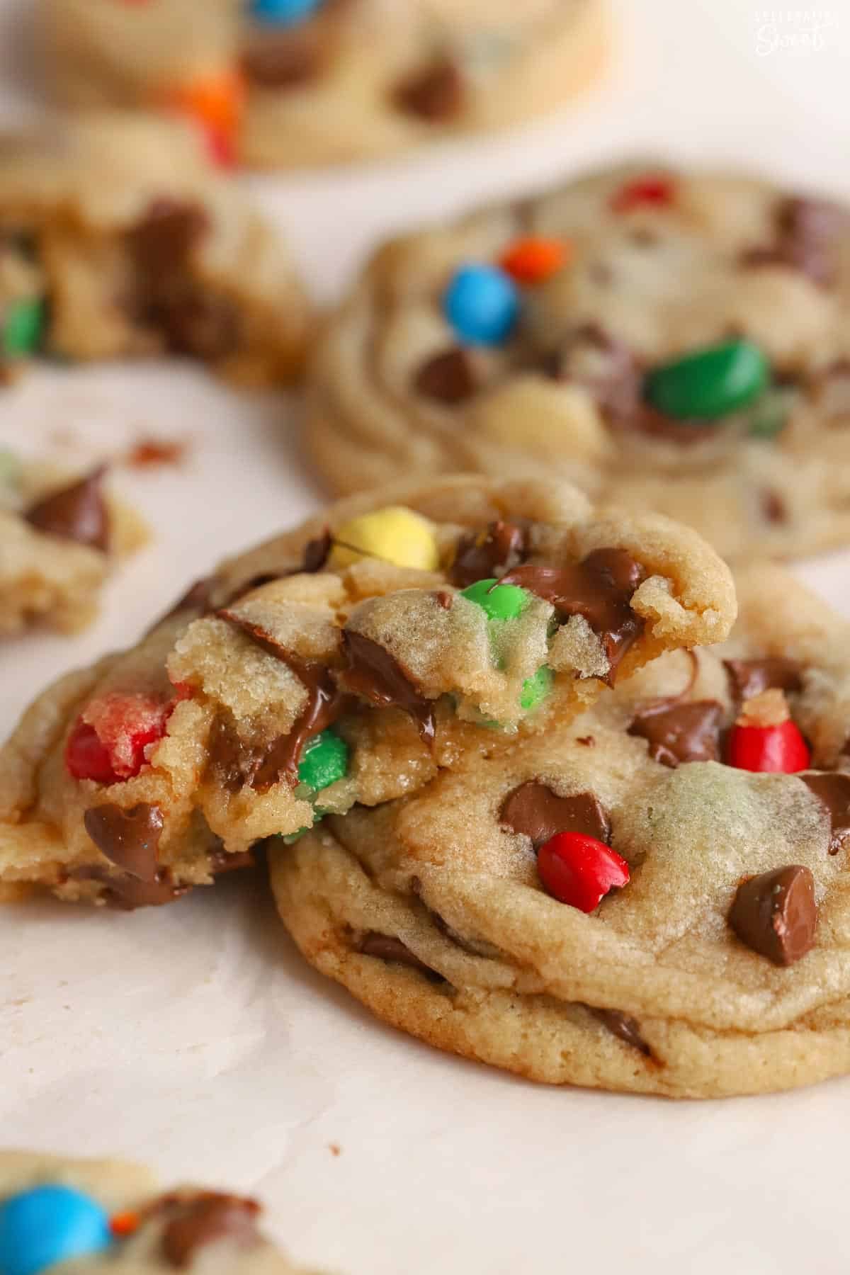 M&M Cookies on parchment paper.