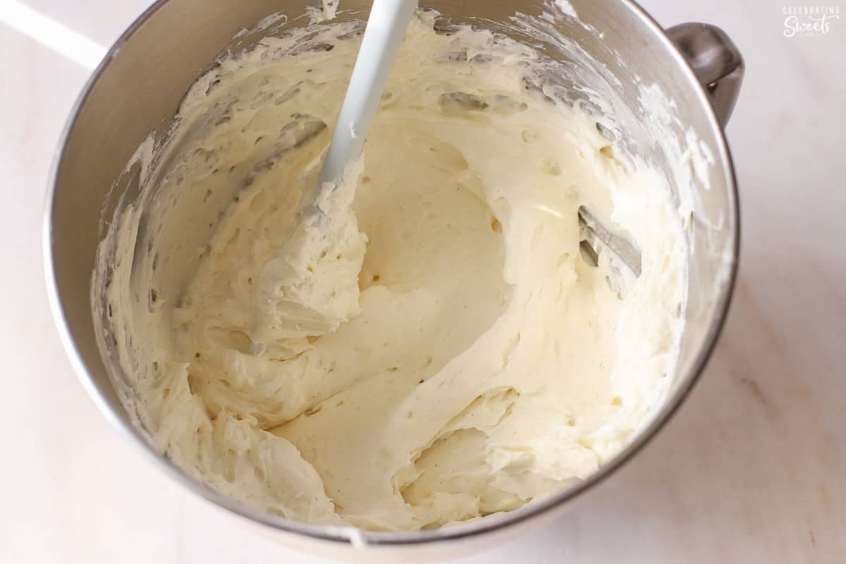 Cheesecake batter in a metal bowl.