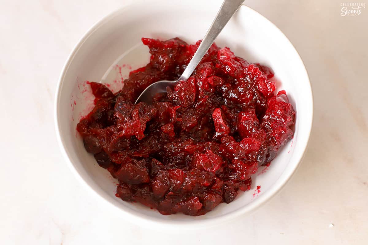 Cranberry sauce in a white bowl.
