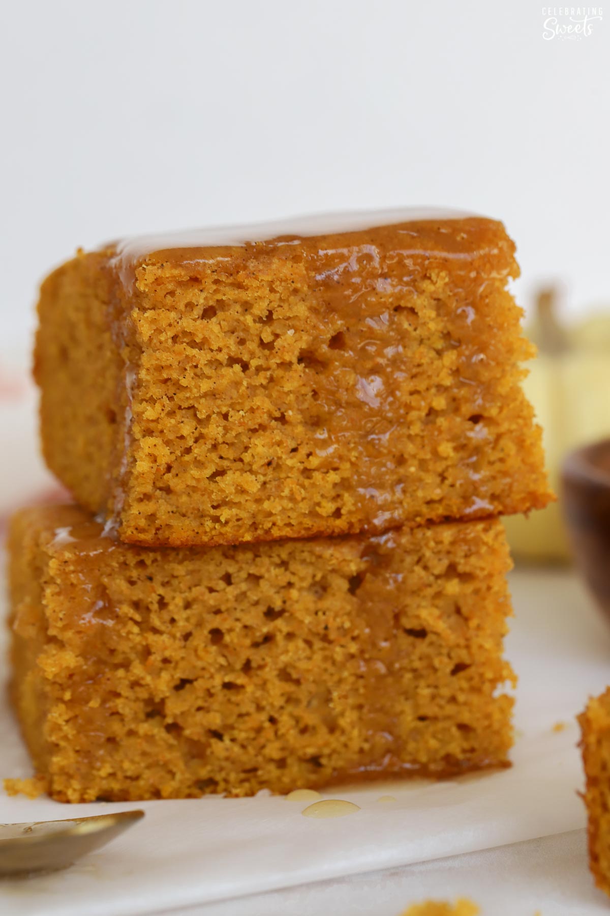 Two square pieces of cornbread stacked on top of each other.