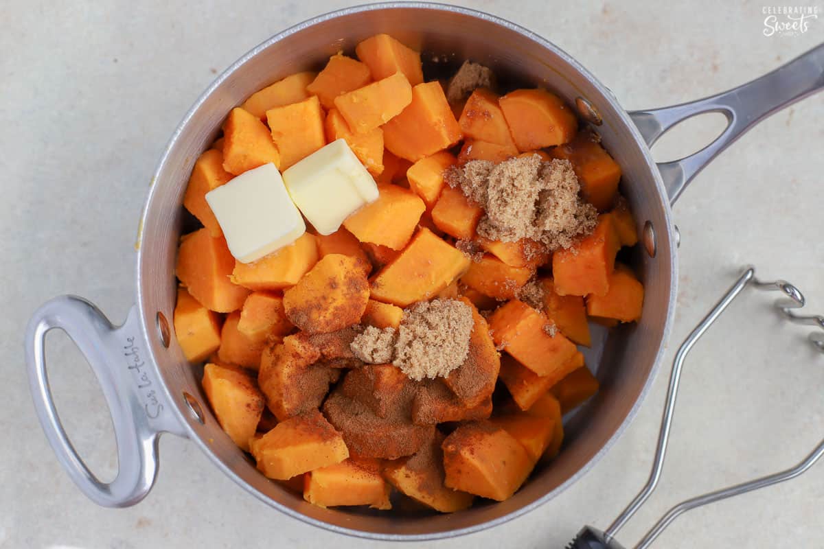 Sweet potatoes, brown sugar, and butter in a saucepan.