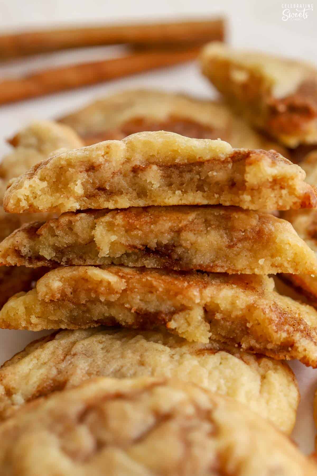 Stack of three halves of cinnamon roll cookies.