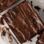 Closeup of a brownie next to a knife