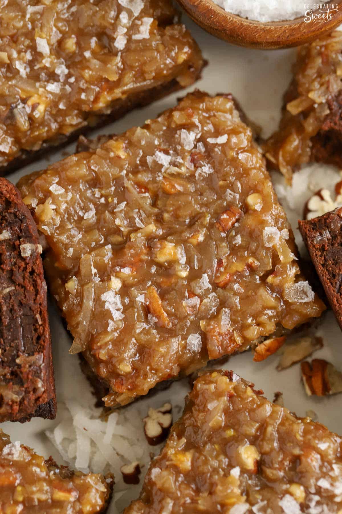 Closeup of a German chocolate brownie topped with flaky sea salt.