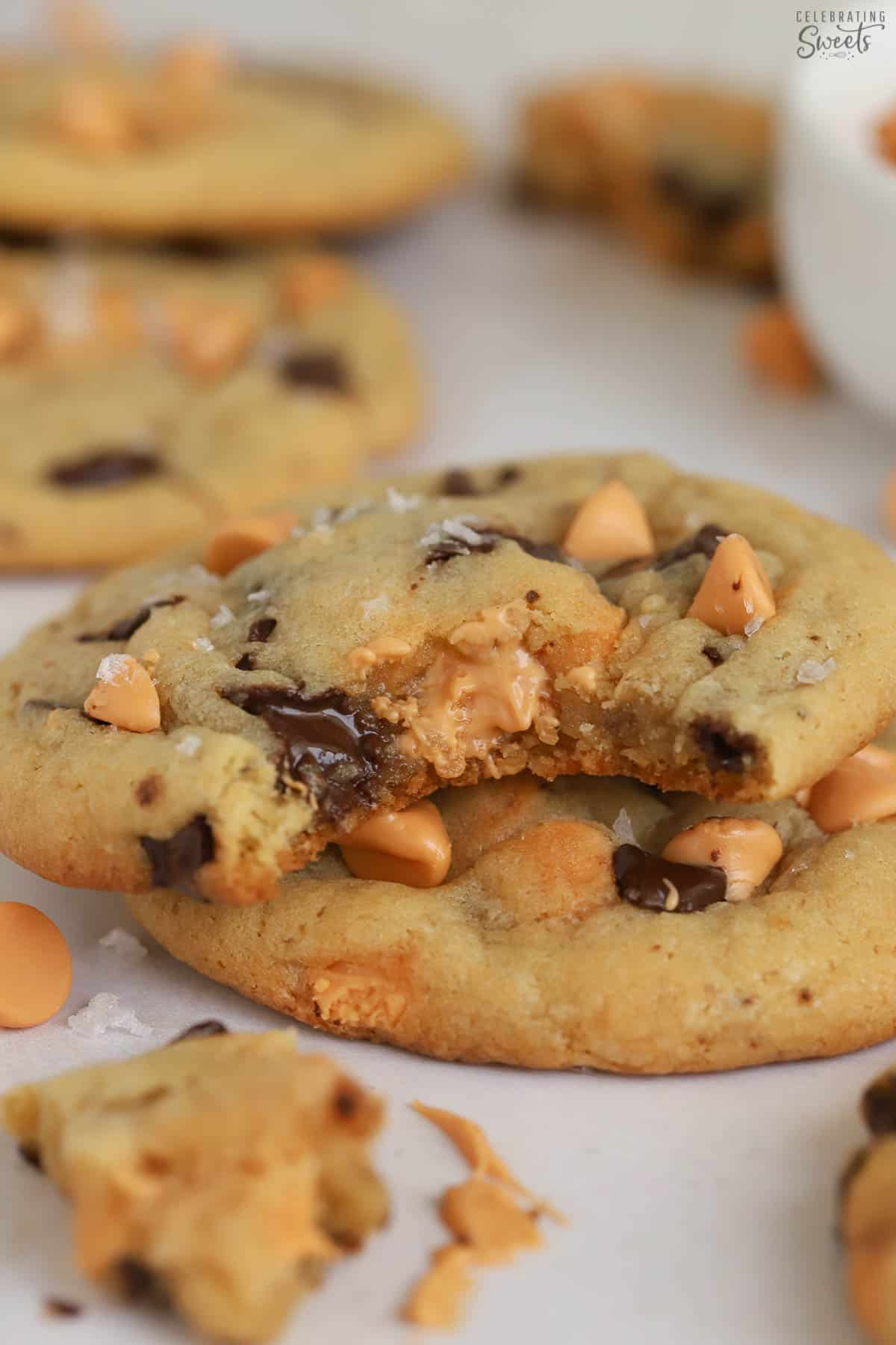 Butterscotch chocolate chip cookie with a bite taken out of it.